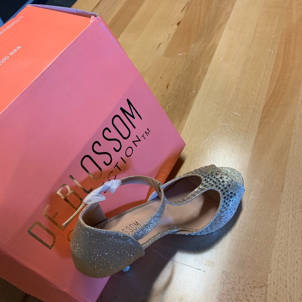 Elegantly Embellished open-toe heel.